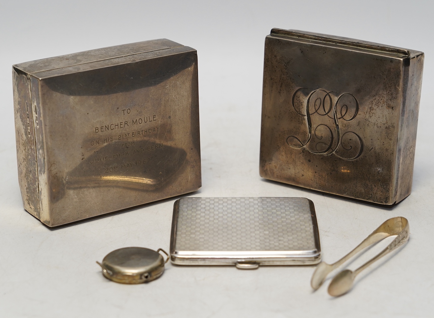 Two early 20th century silver mounted square cigarette boxes, largest 10.1cm, a similar silver cigarette case and three other silver items. Condition - fair to poor